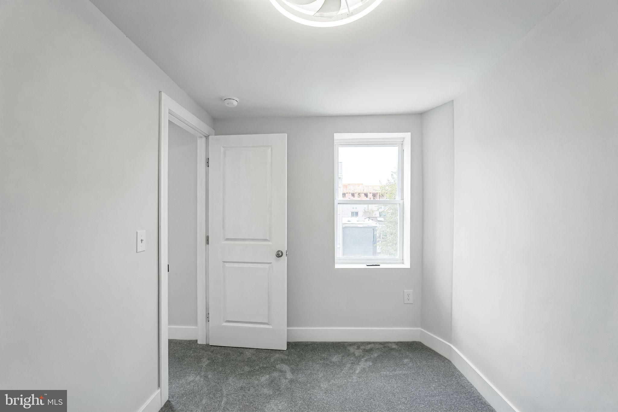 2020 East Cumberland Street Philadelphia, PA 19125 - Photo 20 of 36 an empty room with windows