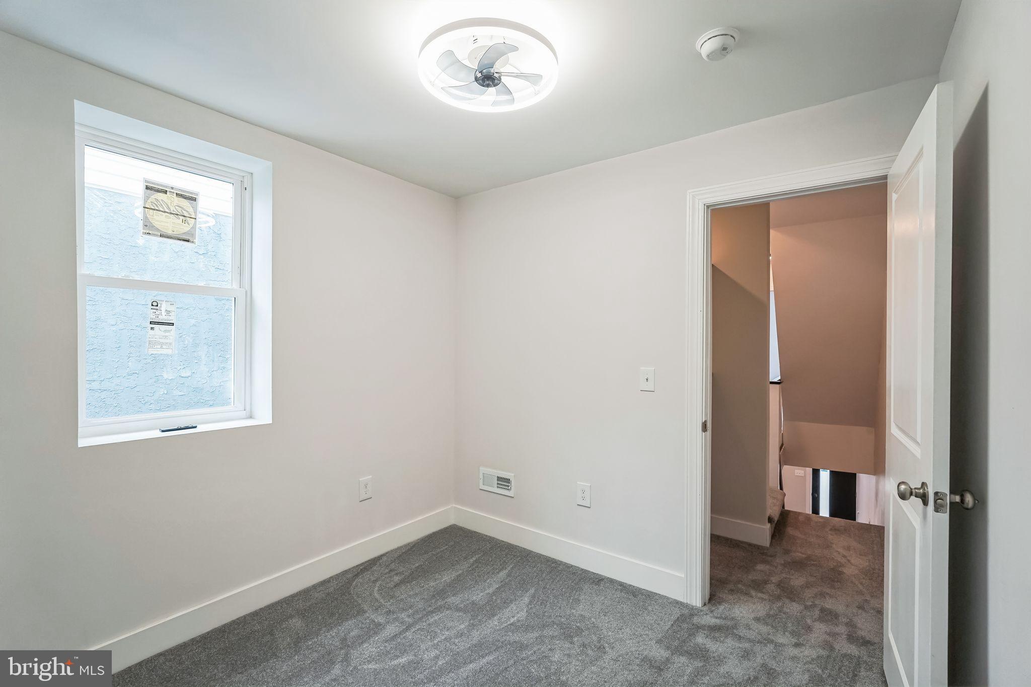 2020 East Cumberland Street Philadelphia, PA 19125 - Photo 23 of 36 an empty room with windows and closet