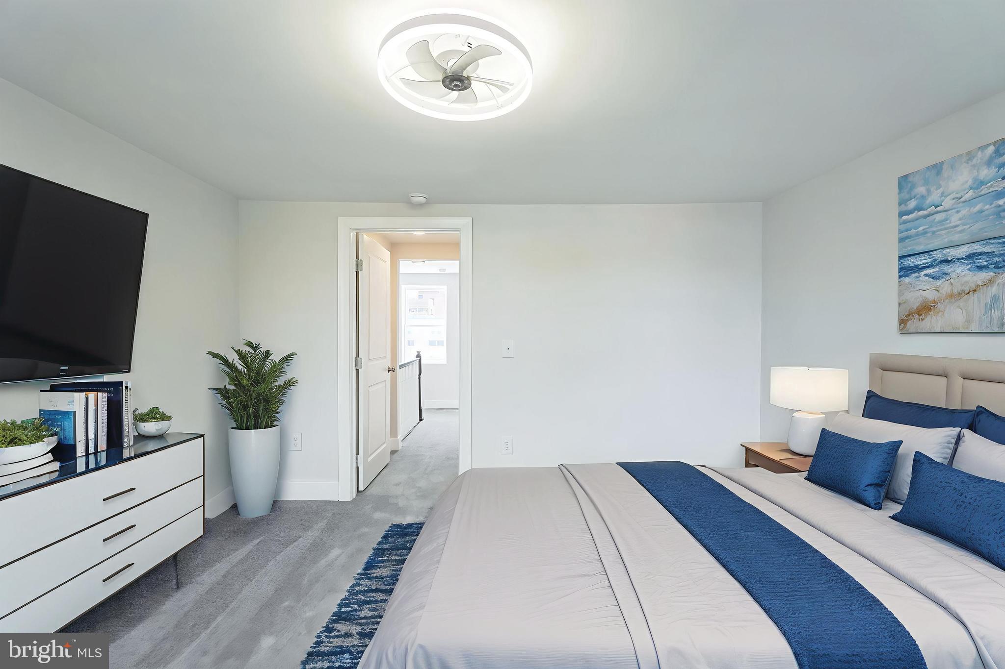 2020 East Cumberland Street Philadelphia, PA 19125 - Photo 27 of 36 a bedroom with a bed and a flat screen tv