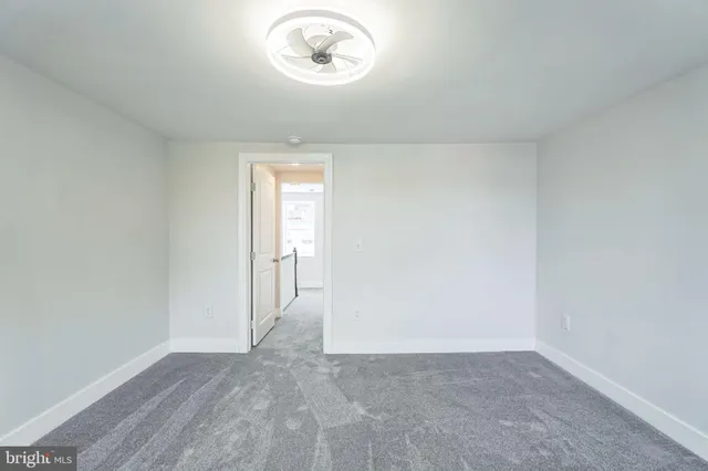 an empty room with a empty space and a window