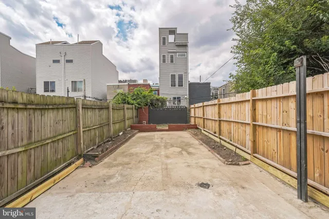a view of a wrought iron fences in front of house