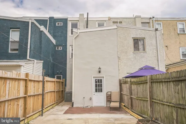 a view of a street with a building in the background