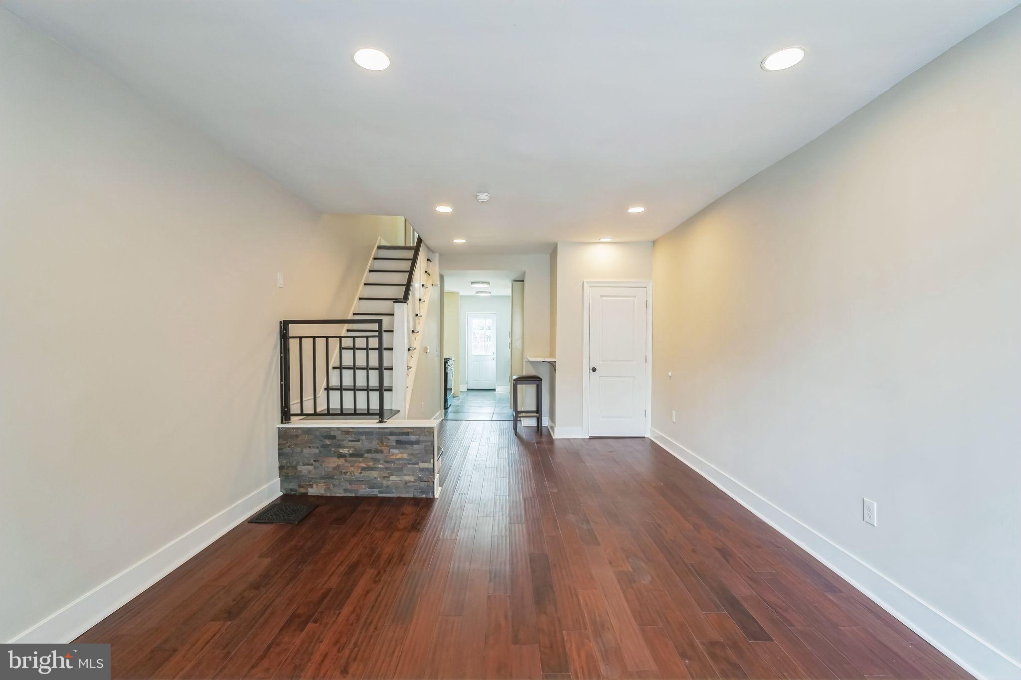 2020 East Cumberland Street Philadelphia, PA 19125 - Photo 10 of 36 a view of an empty room with wooden floor and a window