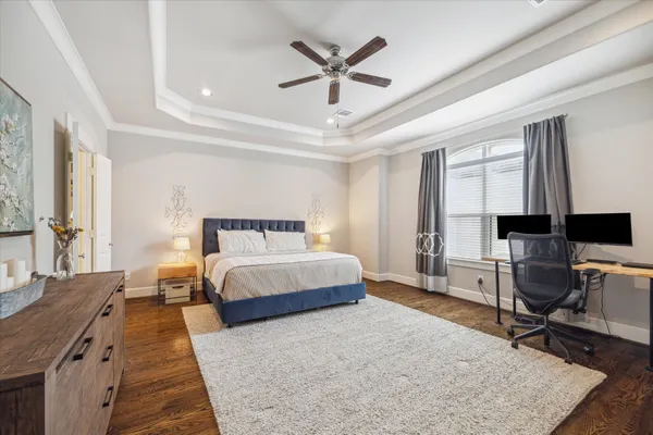 a bed room with a bed and a chair