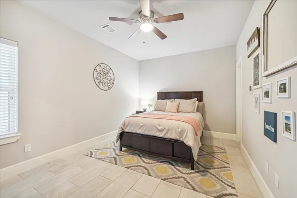 a bedroom with a bed and a table in it