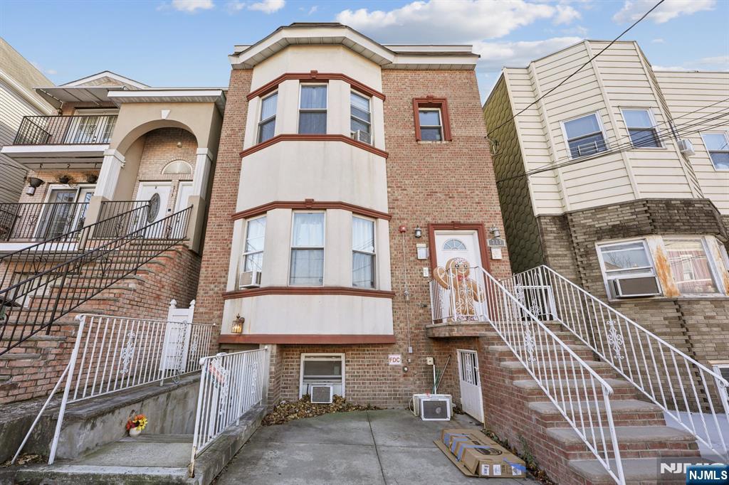 717 16th Street Union City, NJ 07087 - Photo 1 of 27 front view of a house with a door