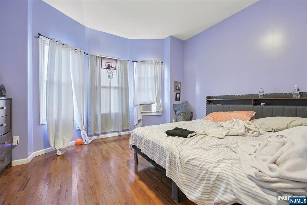 717 16th Street Union City, NJ 07087 - Photo 15 of 27 a bedroom with a bed and a window