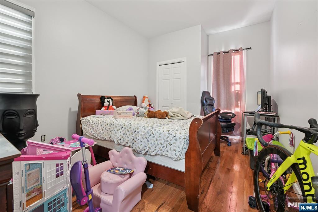 717 16th Street Union City, NJ 07087 - Photo 17 of 27 a bed room with two beds and a bed