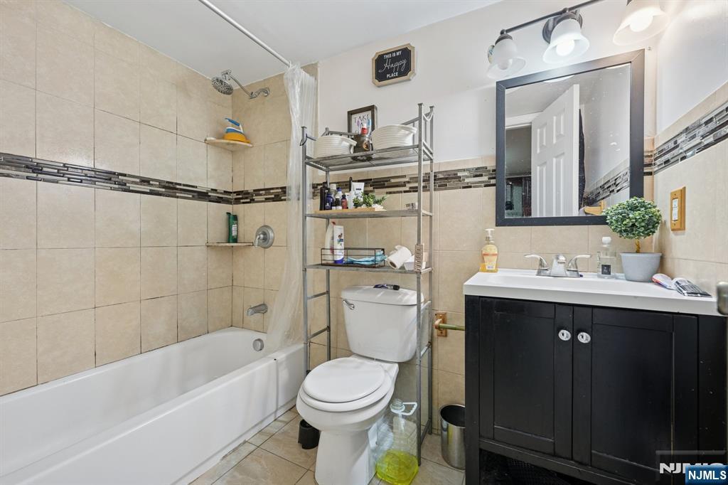 717 16th Street Union City, NJ 07087 - Photo 24 of 27 a bathroom with a sink toilet and shower