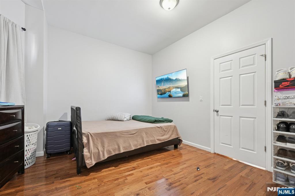 717 16th Street Union City, NJ 07087 - Photo 25 of 27 a bedroom with a bed and a closet