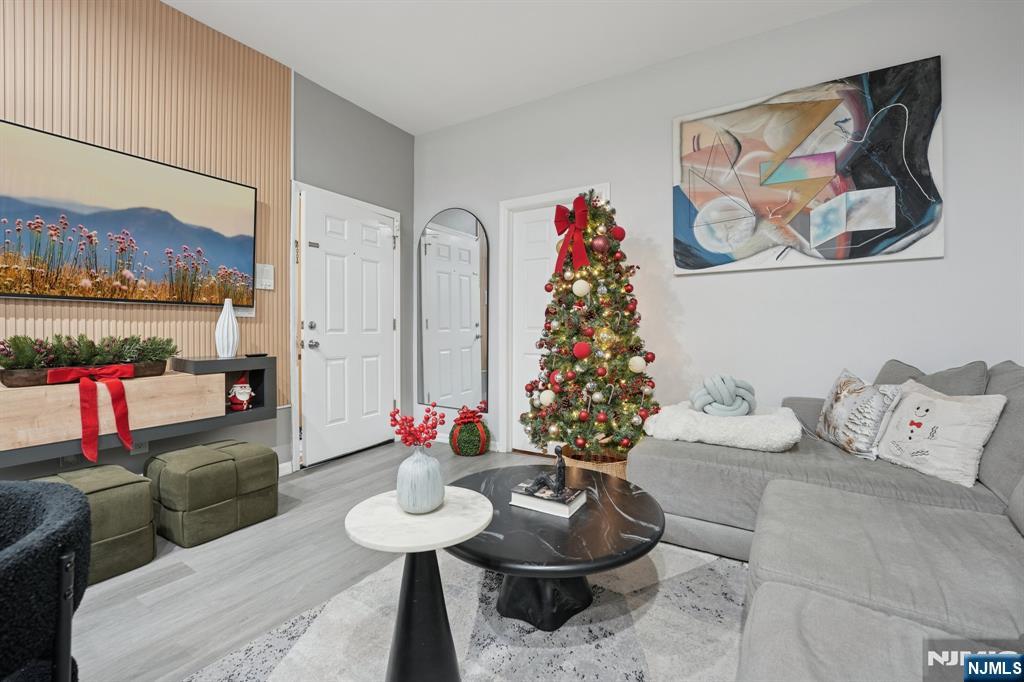 717 16th Street Union City, NJ 07087 - Photo 4 of 27 a living room with furniture and a potted plant