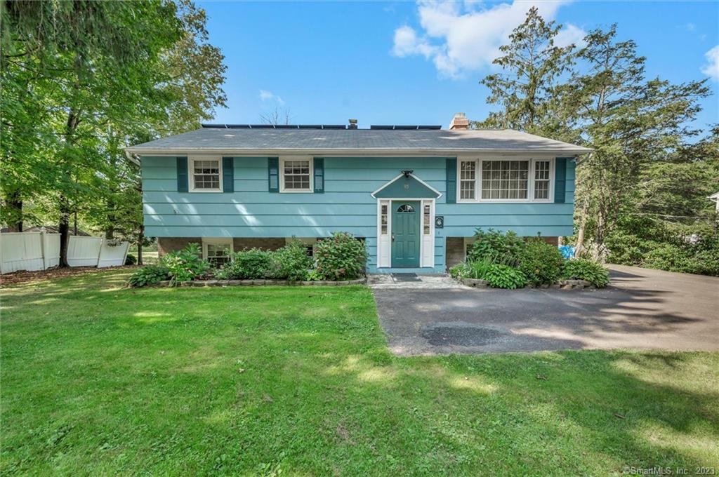 85 Tuttle Road Durham, CT 06422 - Photo 1 of 1 a front view of a house with a garden