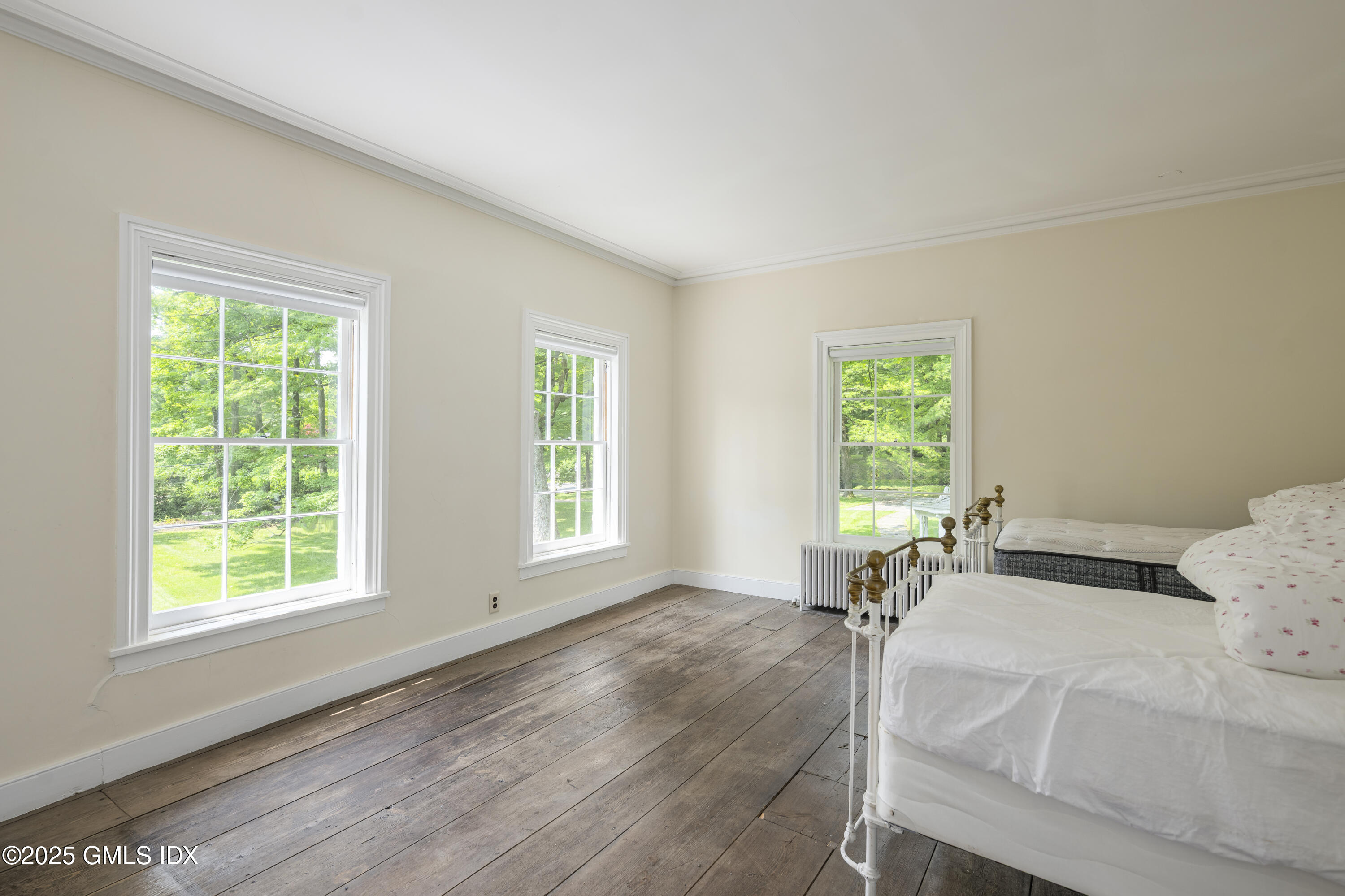 295 Taconic Road Greenwich, CT 06831 - Photo 11 of 35 a room with a bed and windows