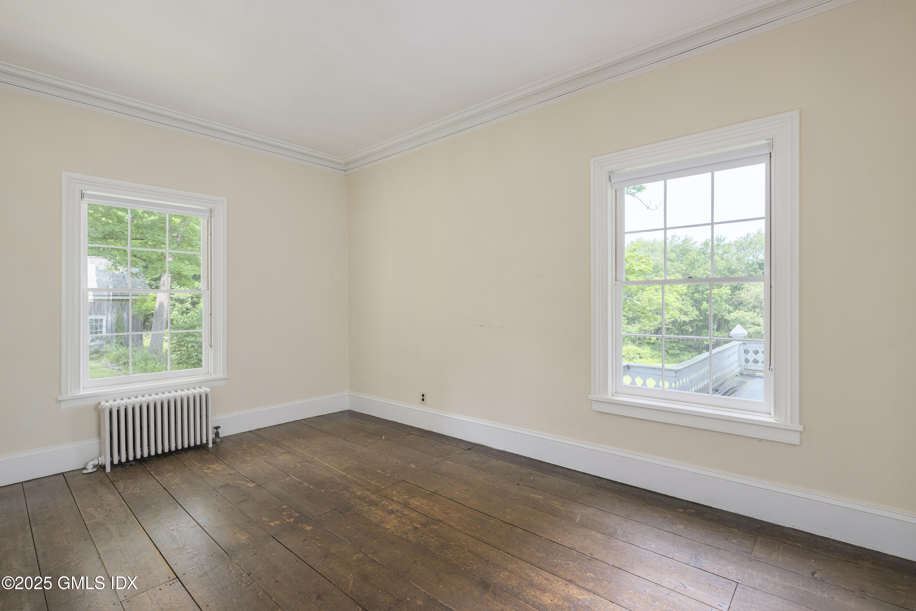 295 Taconic Road Greenwich, CT 06831 - Photo 14 of 35 an empty room with wooden floor and windows