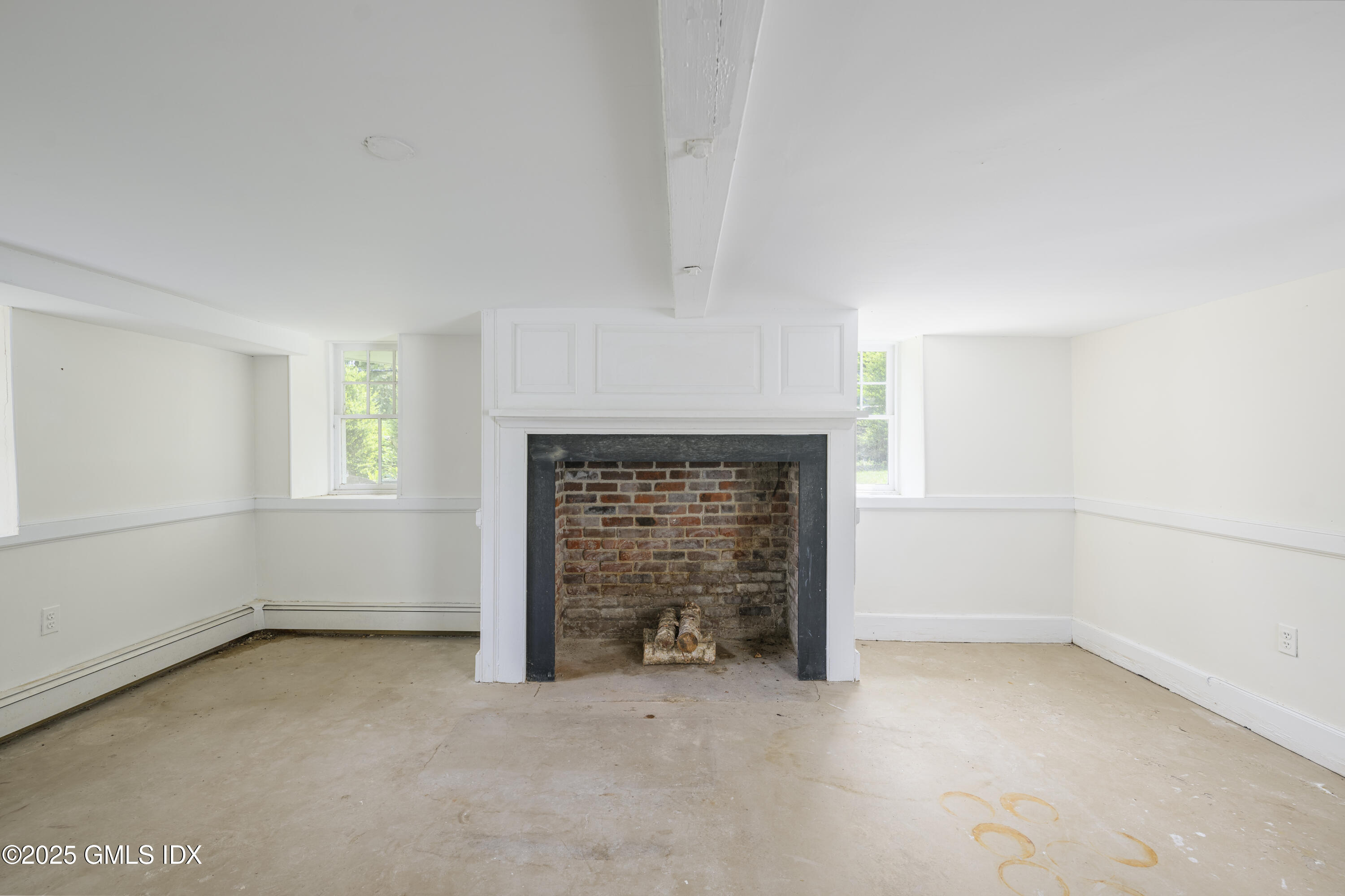 295 Taconic Road Greenwich, CT 06831 - Photo 18 of 35 an empty room with windows and fireplace