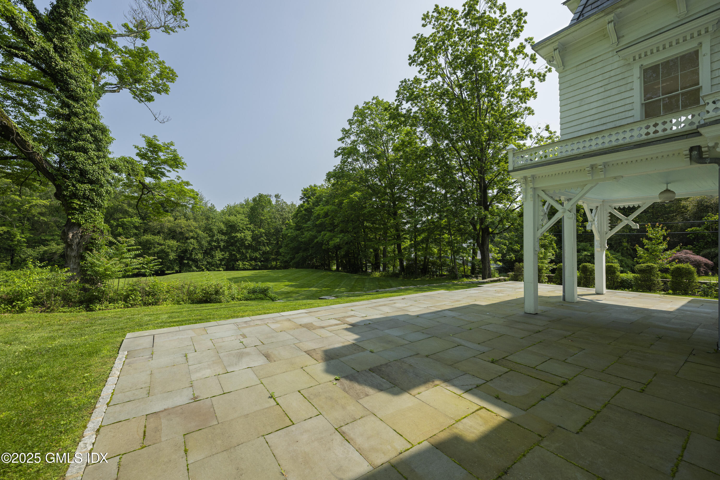 295 Taconic Road Greenwich, CT 06831 - Photo 19 of 35 a view of a house with a yard