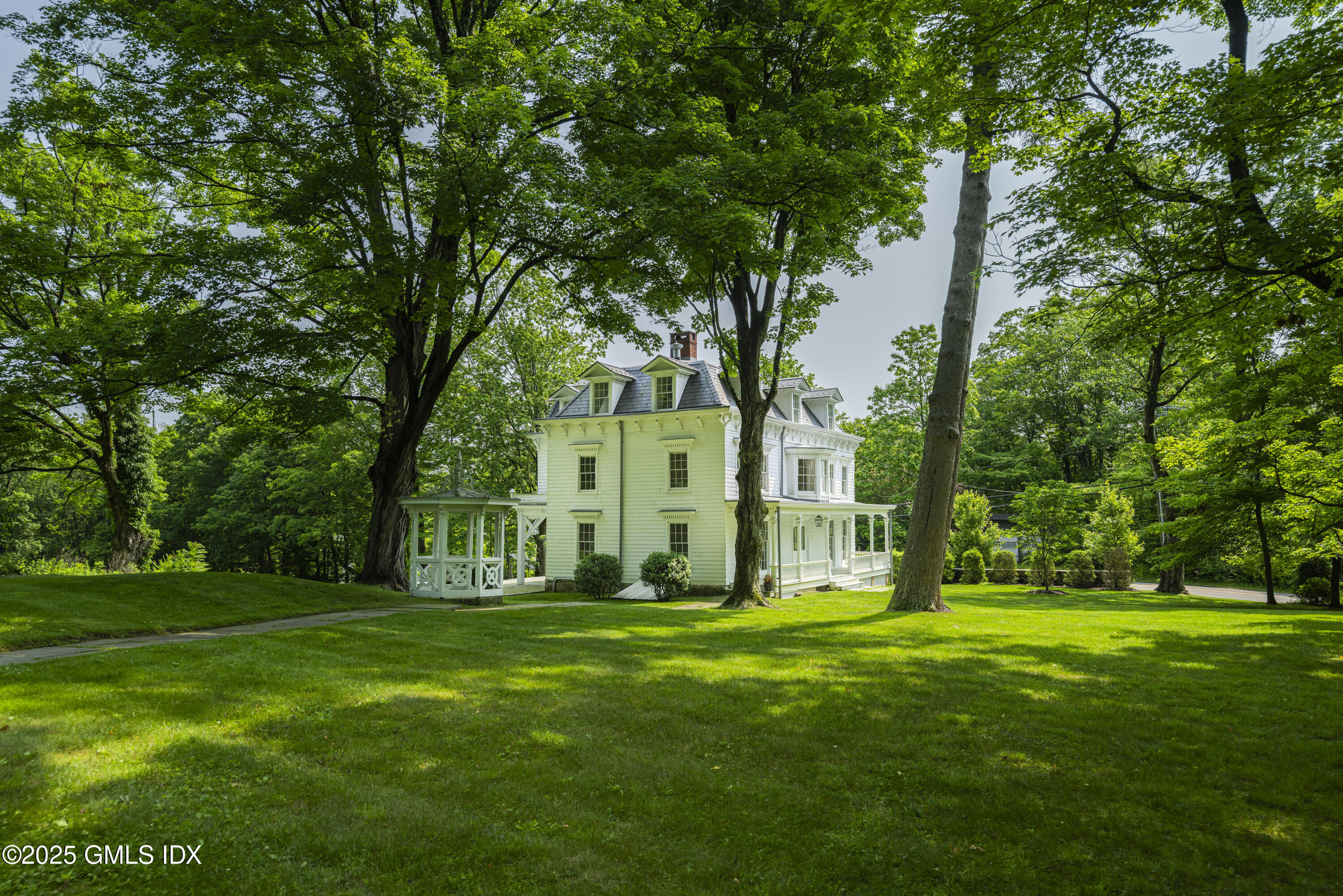 295 Taconic Road Greenwich, CT 06831 - Photo 27 of 35 a big yard with plants and large trees