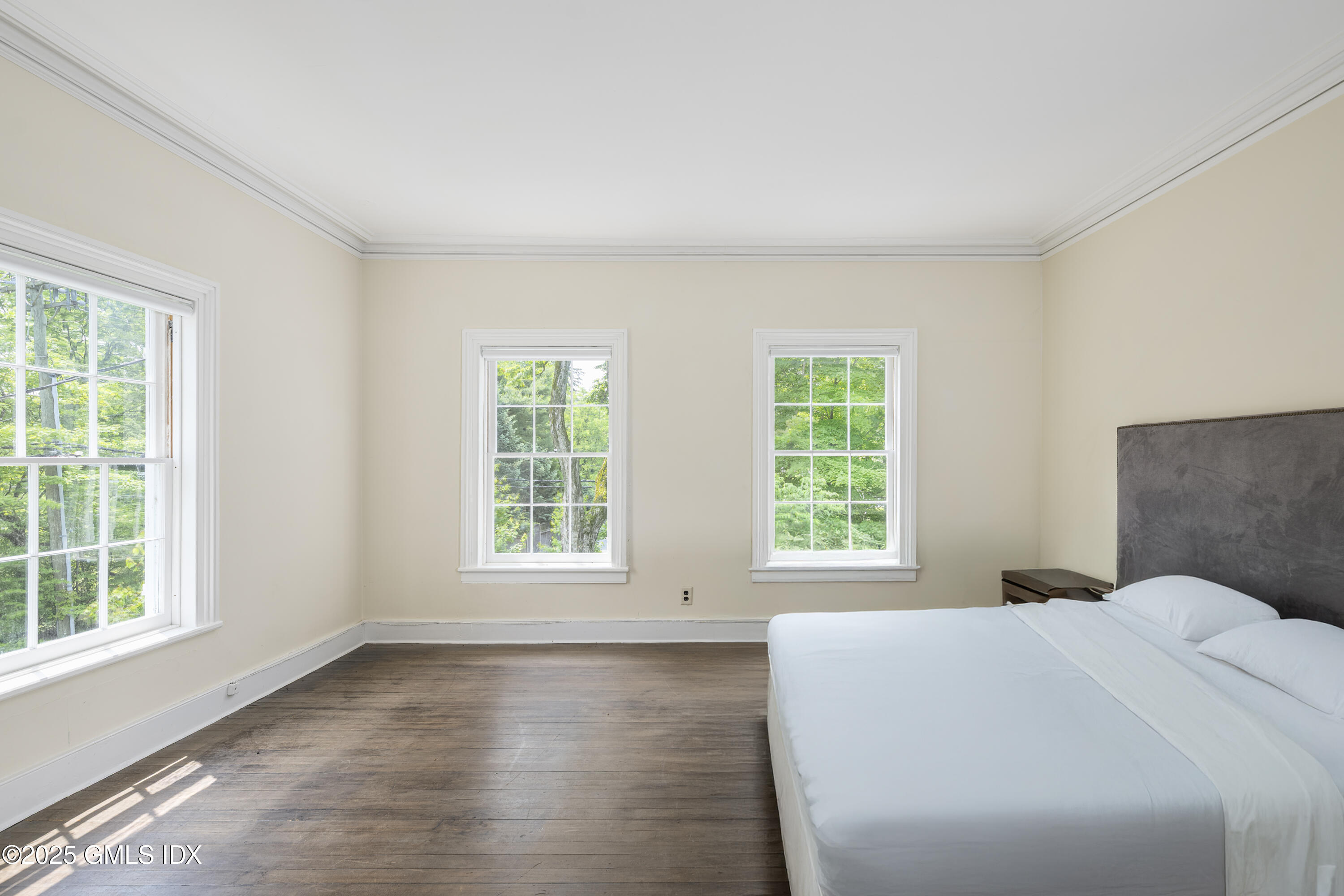 295 Taconic Road Greenwich, CT 06831 - Photo 8 of 35 a bed sitting in a bedroom next to a window