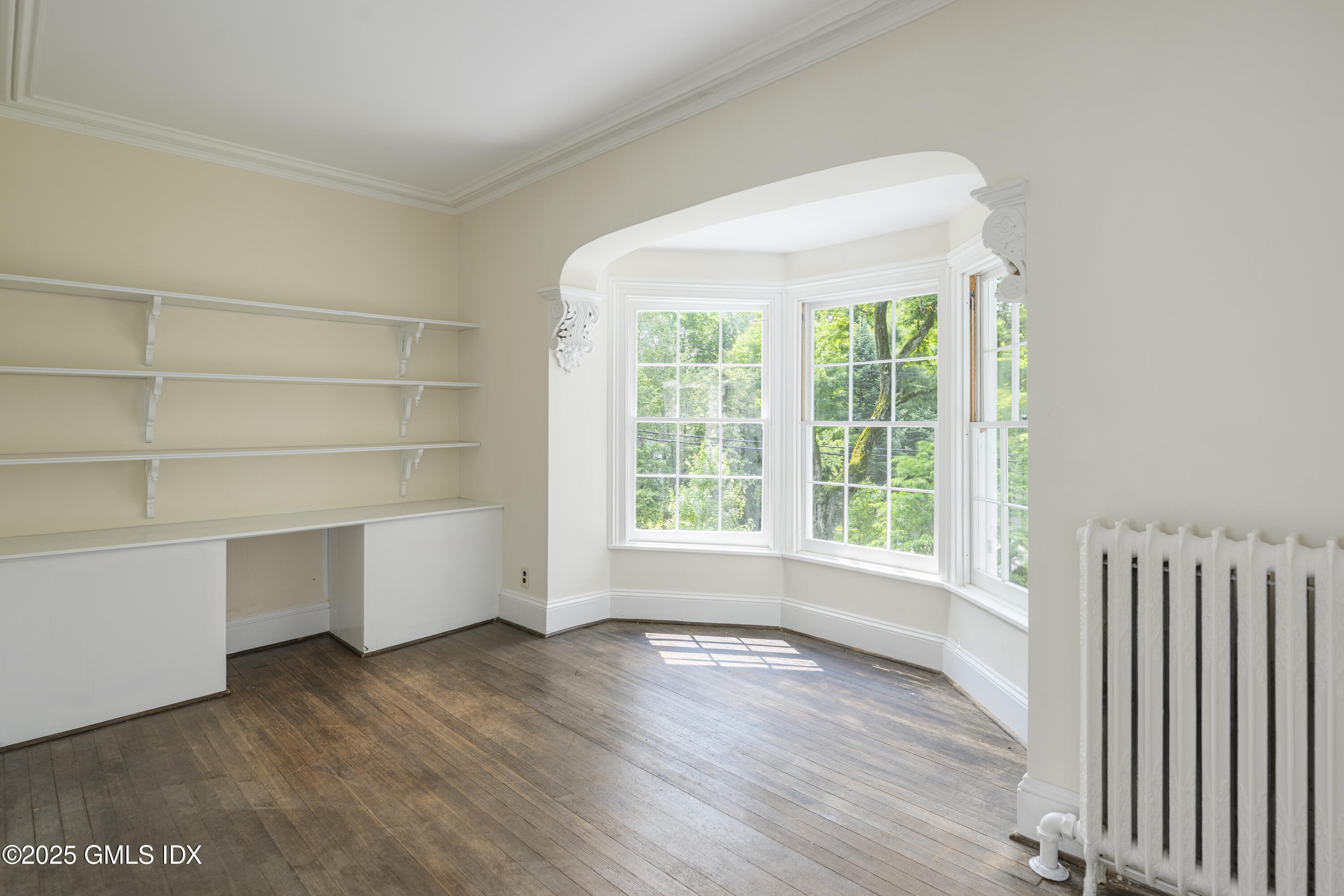 295 Taconic Road Greenwich, CT 06831 - Photo 10 of 35 an empty room with wooden floor and windows