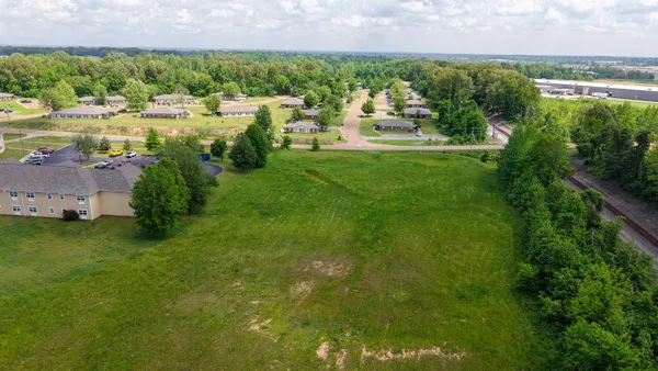 a view of a lake with building and outdoor space