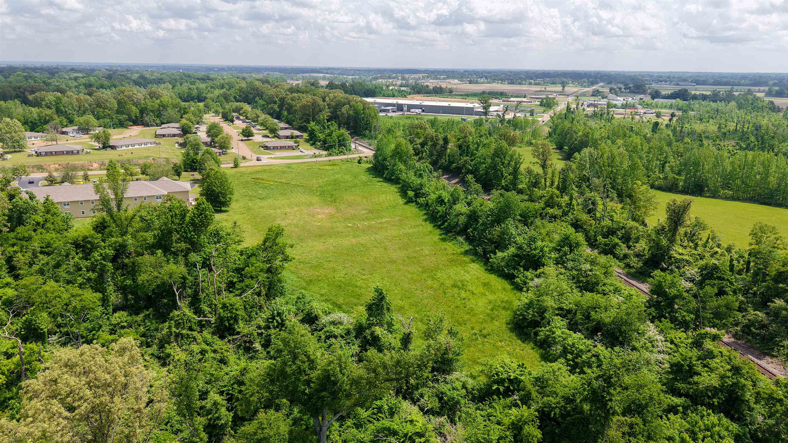 375 Mueller Brass Road Covington, TN 38019 - Photo 4 of 9 a view of a lake with a city