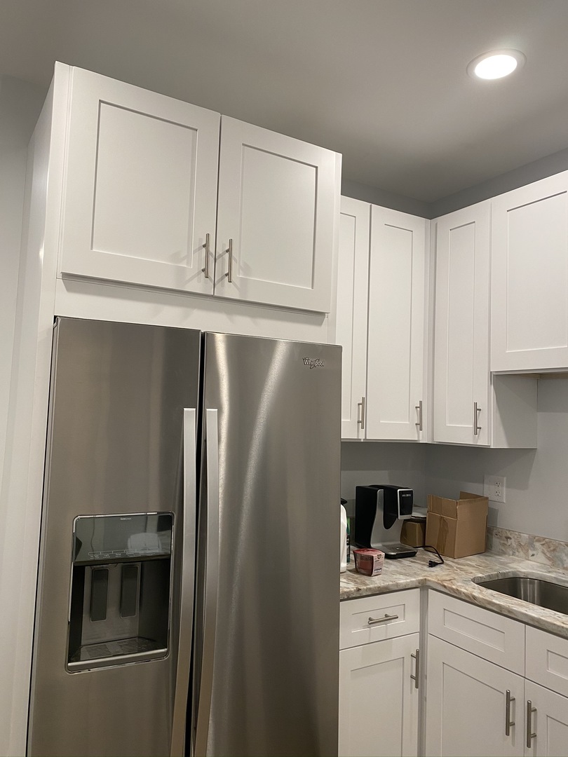 1309 West Fillmore Street, Unit 1 Chicago, IL 60607 - Photo 3 of 9 a kitchen with cabinets and stainless steel appliances