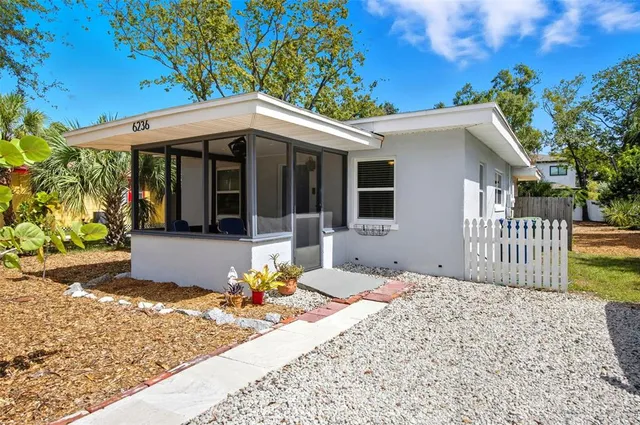 a front view of a house with a porch