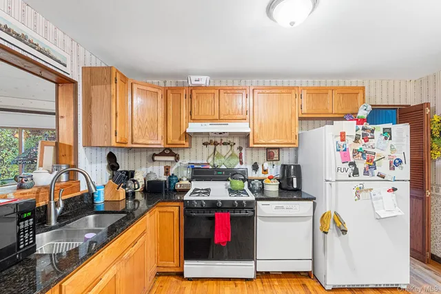a kitchen with refrigerator and window