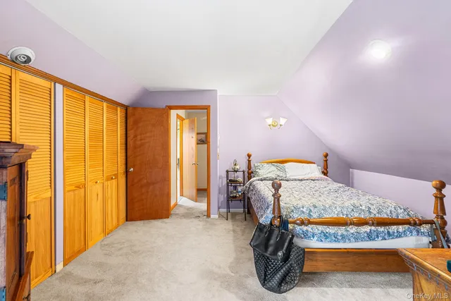 a bedroom with a bed and dresser