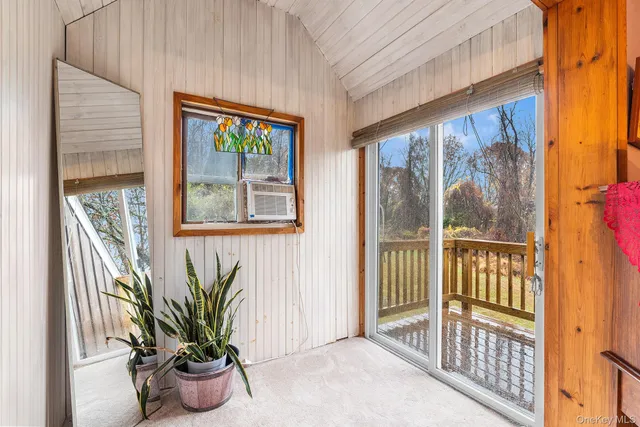 a view of a porch with a potted plant