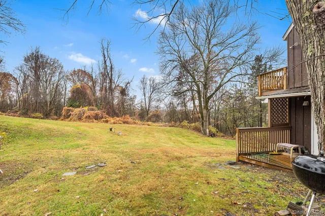 a view of a swimming pool with an outdoor space and seating area