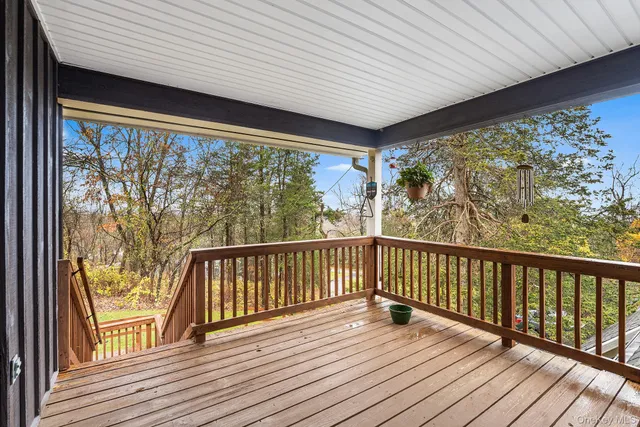 a view of balcony with wooden floor