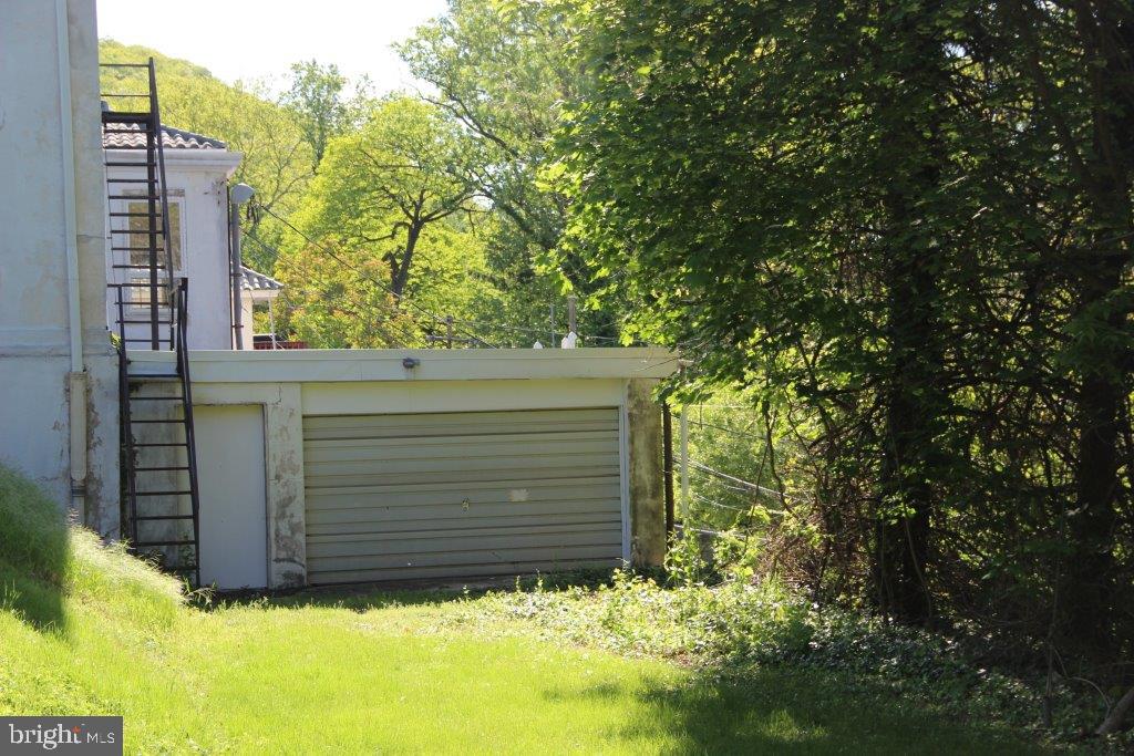1720 Mineral Spring Road Reading, PA 19602 - Photo 19 of 26 a view of house with trees in front of it