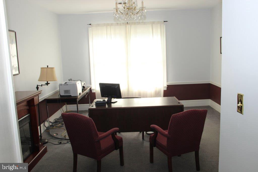 1720 Mineral Spring Road Reading, PA 19602 - Photo 21 of 26 a workspace with furniture and a chandelier