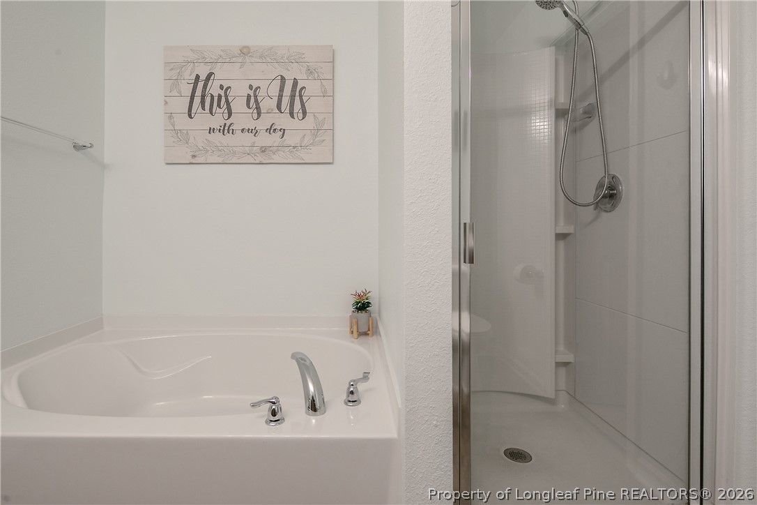 340 Battery Way Bunnlevel, NC 28323 - Photo 30 of 50 a bathroom with a bathtub