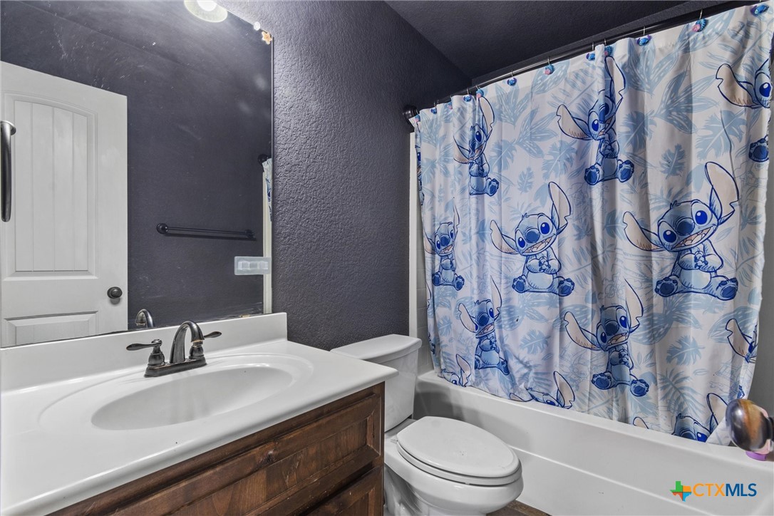 6405 Deorsam Loop Killeen, TX 76542 - Photo 21 of 36 a bathroom with a sink and a toilet