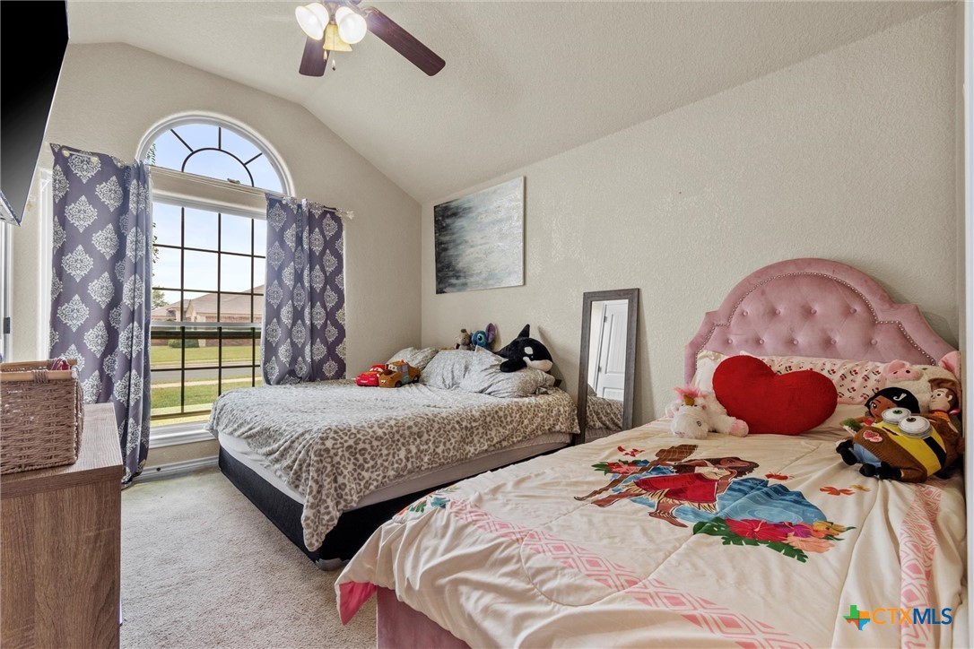 6405 Deorsam Loop Killeen, TX 76542 - Photo 23 of 36 a bedroom with two beds and a large window