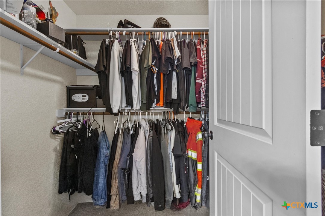 6405 Deorsam Loop Killeen, TX 76542 - Photo 28 of 36 a view of walk in closet with clothes