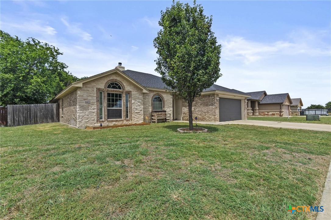 6405 Deorsam Loop Killeen, TX 76542 - Photo 3 of 36 a front view of a house with a garden