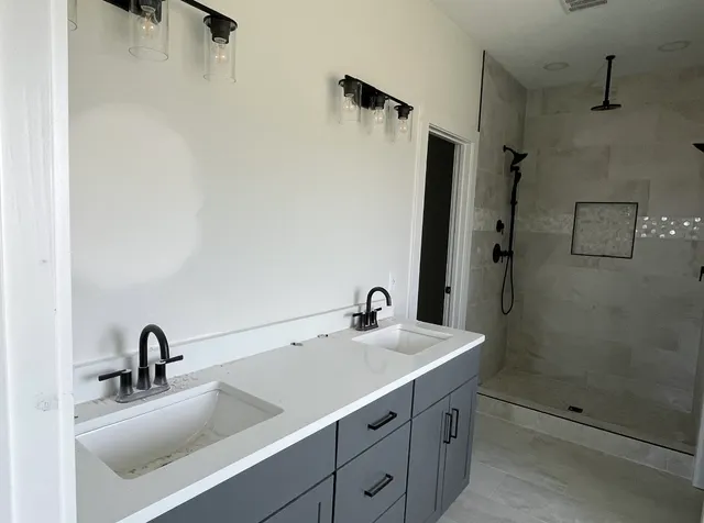a bathroom with a sink and mirror