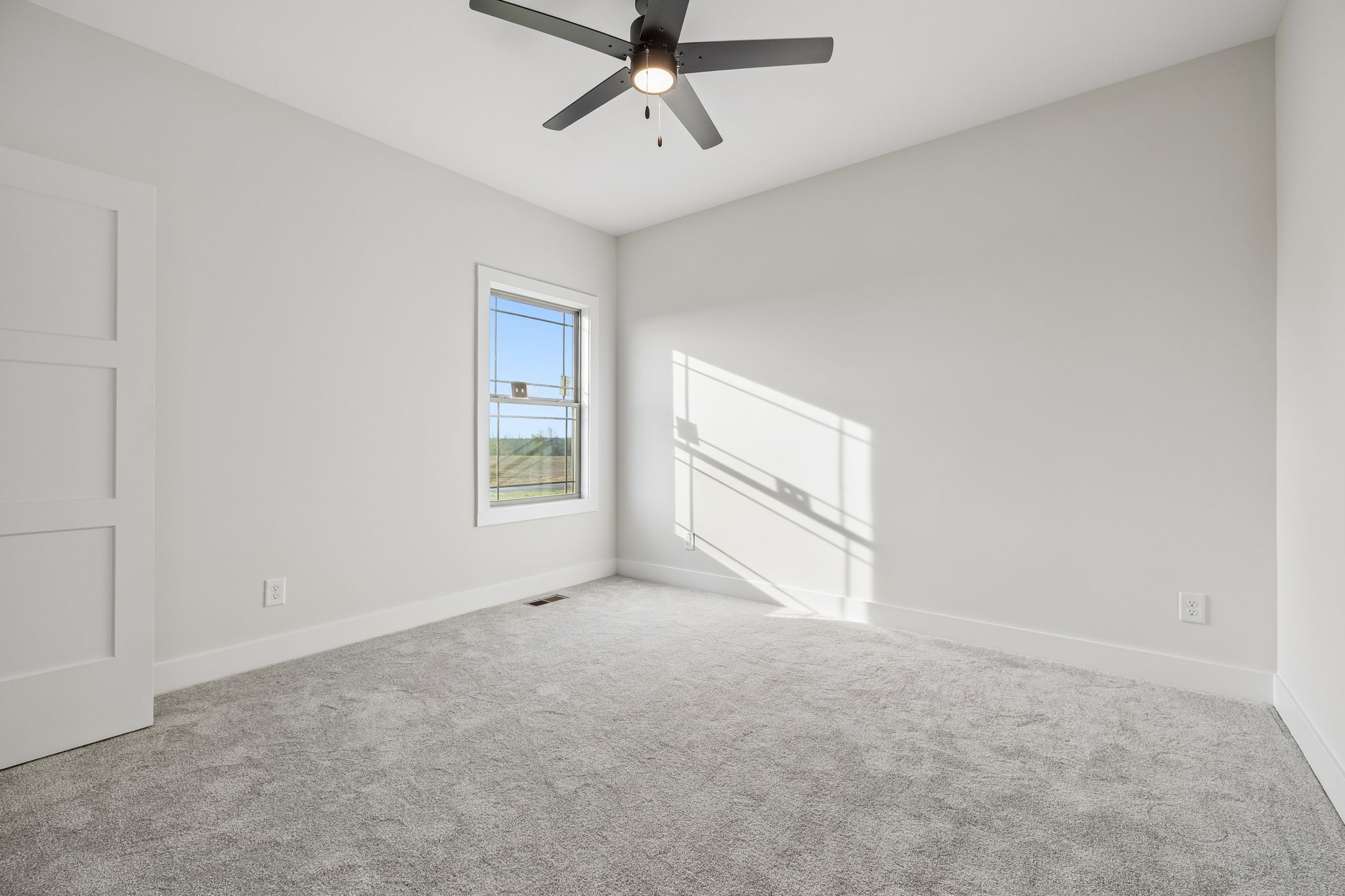 1015 Linder Ridge Road Woodlawn, TN 37191 - Photo 12 of 55 an empty room with windows and ceiling fan