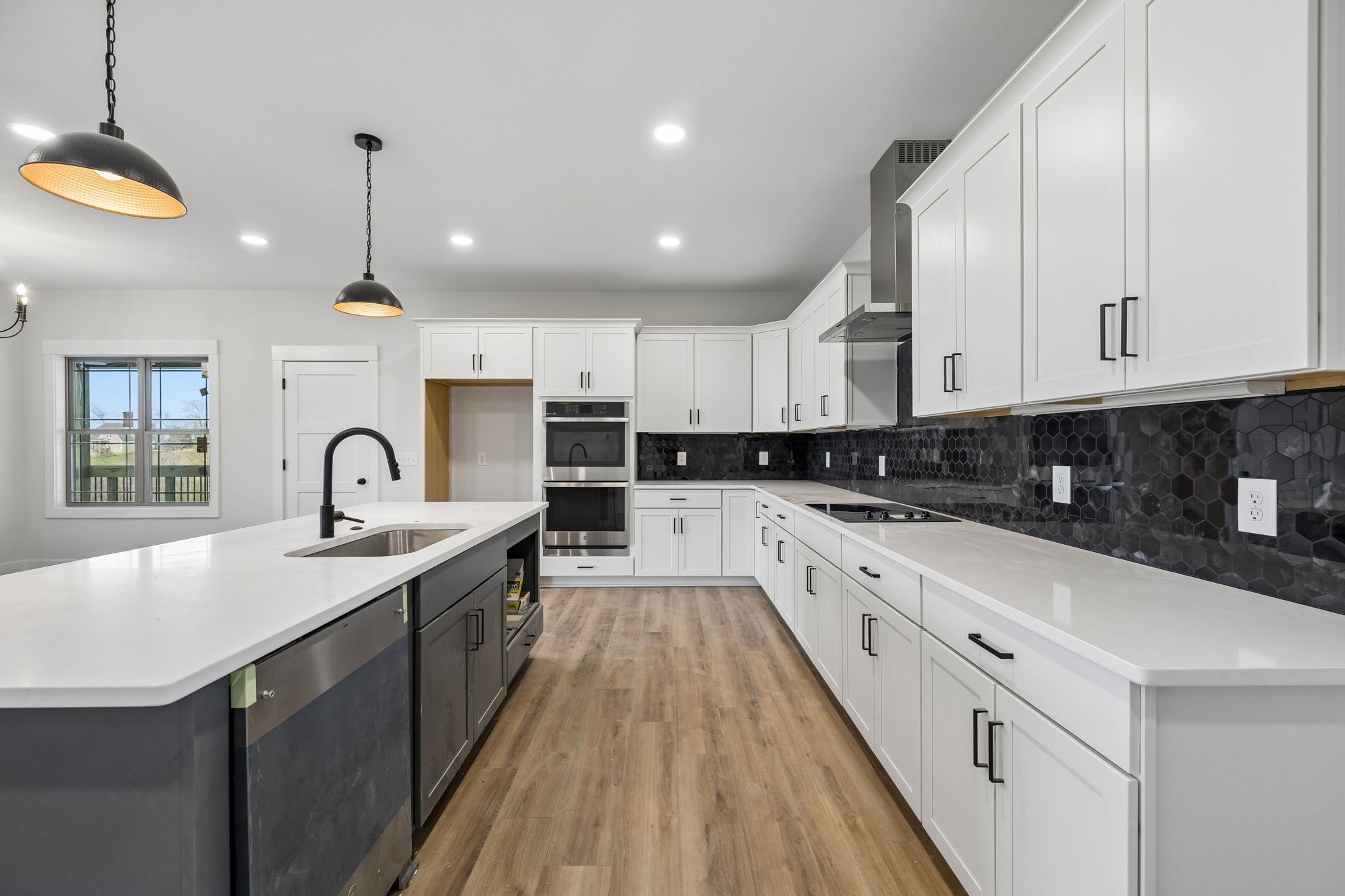 1015 Linder Ridge Road Woodlawn, TN 37191 - Photo 14 of 55 a large kitchen with stainless steel appliances granite countertop a sink and cabinets