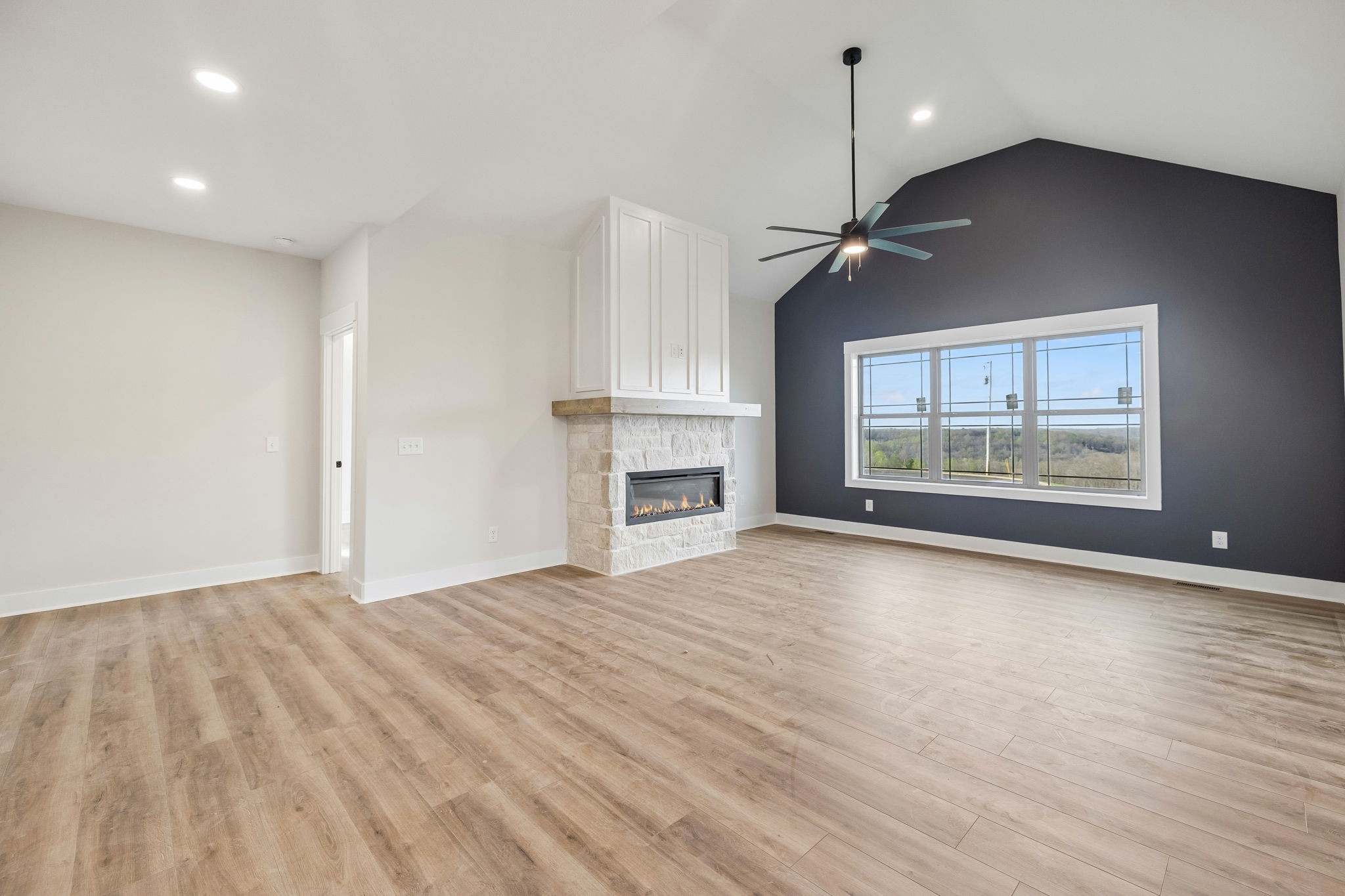 1015 Linder Ridge Road Woodlawn, TN 37191 - Photo 22 of 55 a view of empty room with wooden floor and fan