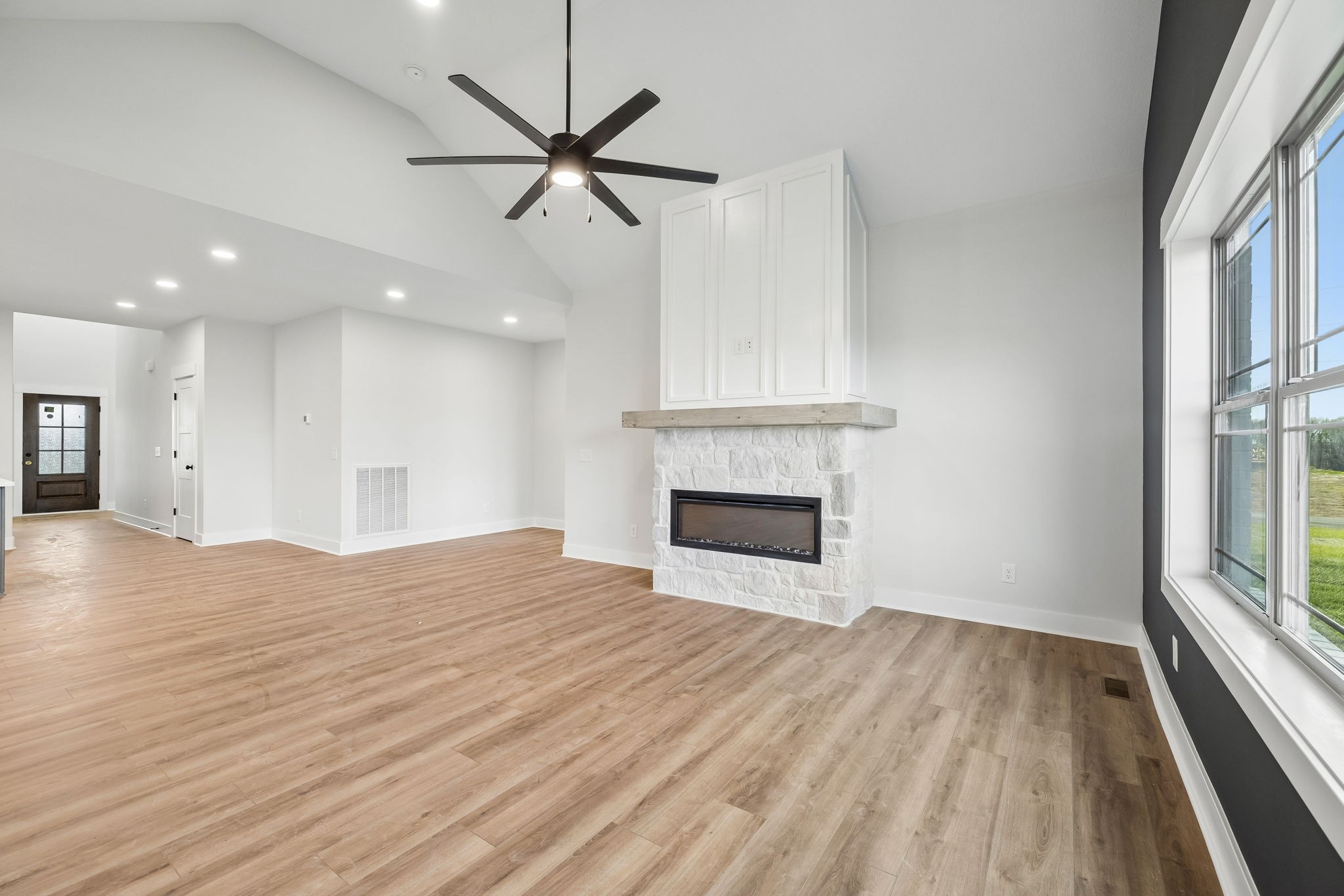 1015 Linder Ridge Road Woodlawn, TN 37191 - Photo 23 of 55 a view of empty room with wooden floor and fireplace