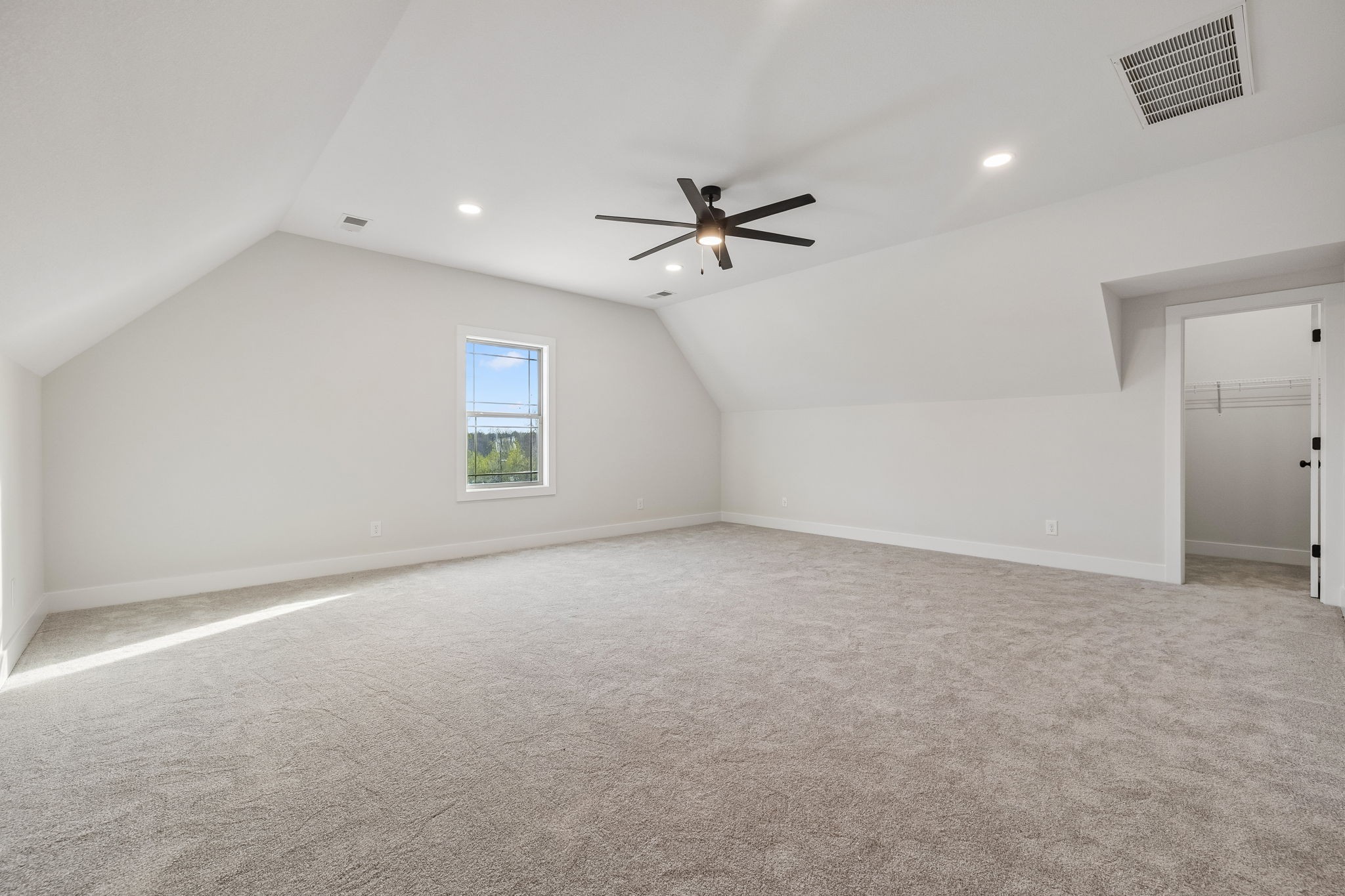 1015 Linder Ridge Road Woodlawn, TN 37191 - Photo 35 of 55 an empty room with a ceiling fan and a window