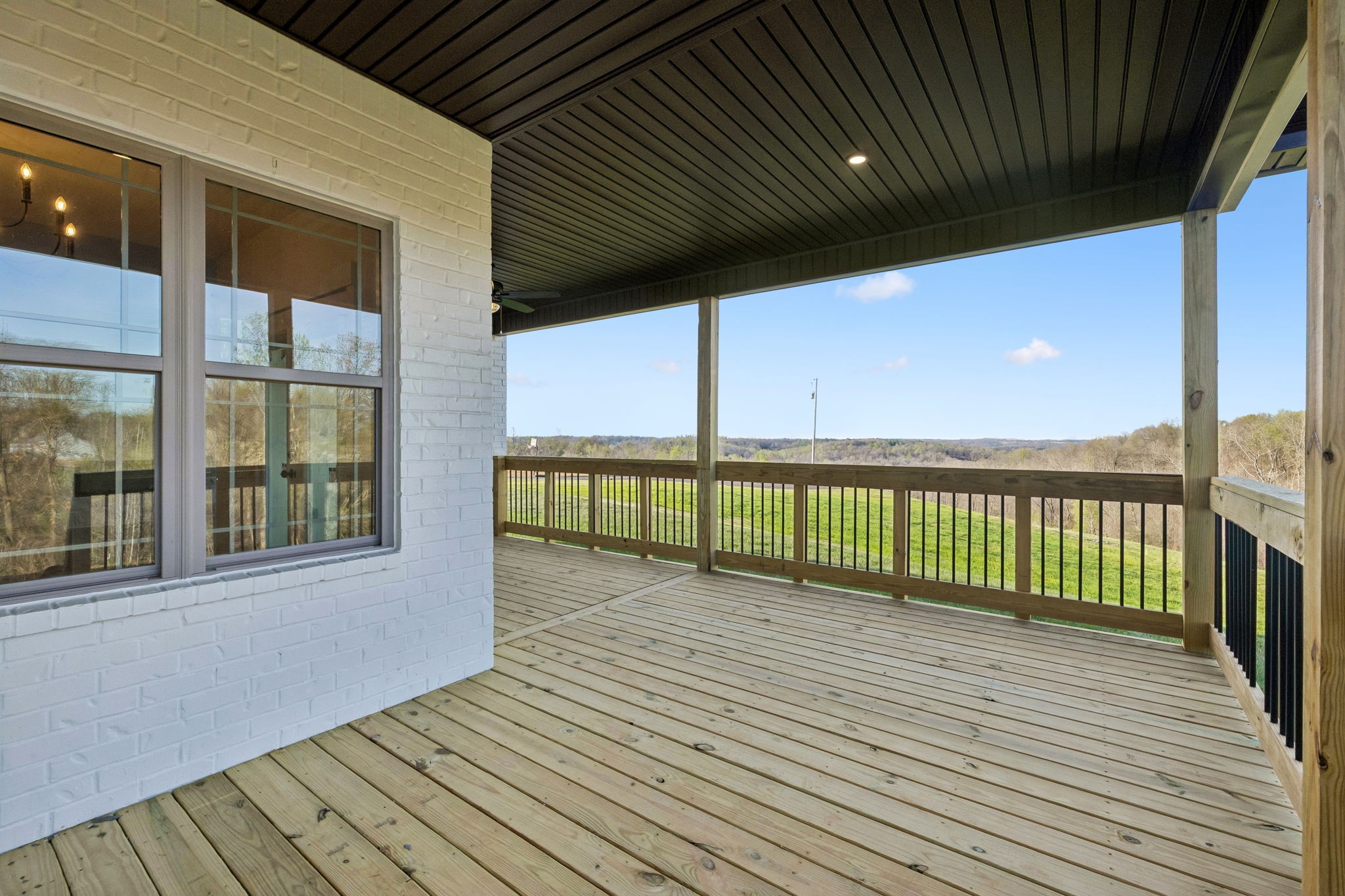 1015 Linder Ridge Road Woodlawn, TN 37191 - Photo 41 of 55 a view of a balcony with wooden floor