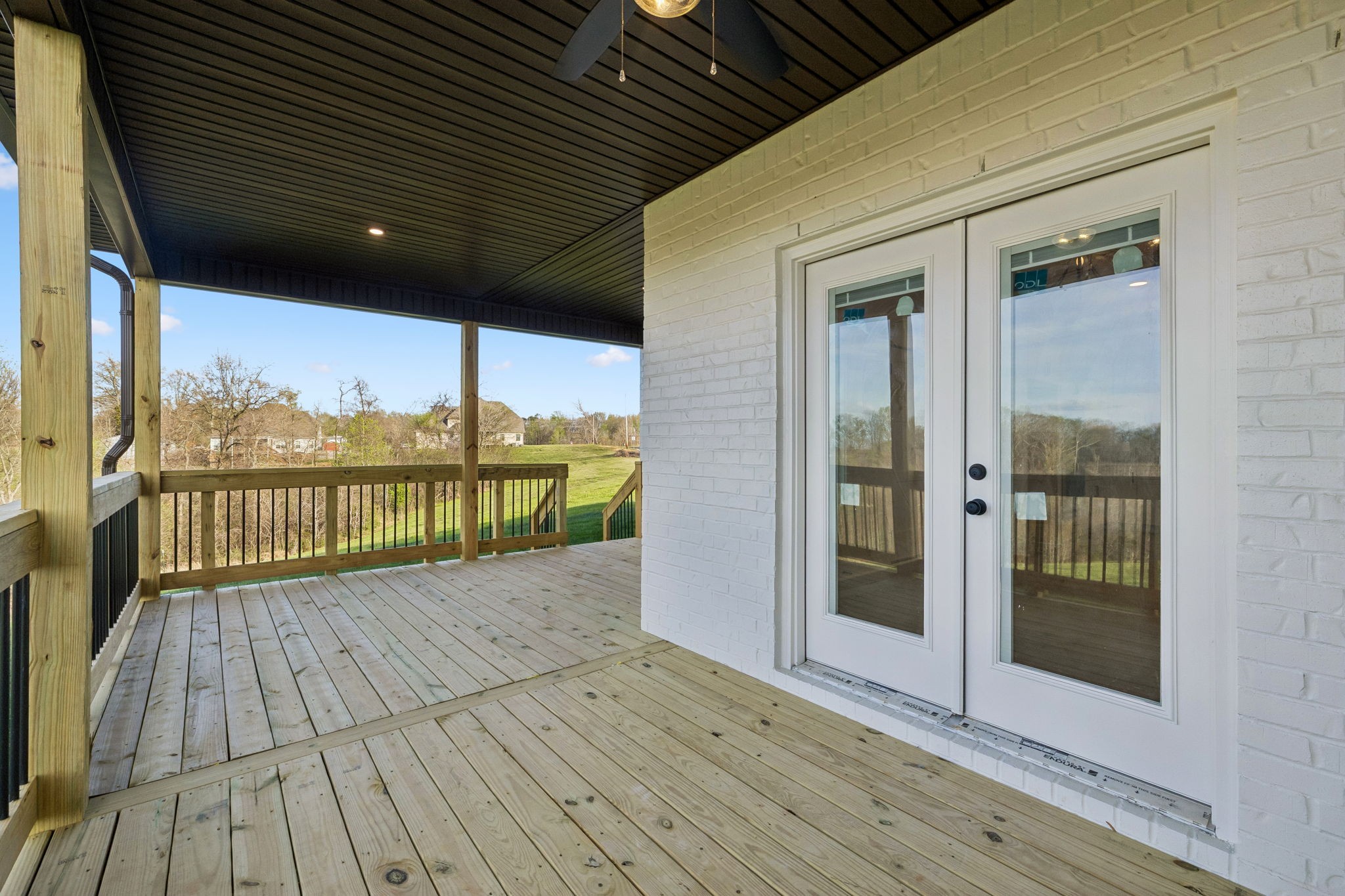 1015 Linder Ridge Road Woodlawn, TN 37191 - Photo 43 of 55 a view of a balcony with wooden floor