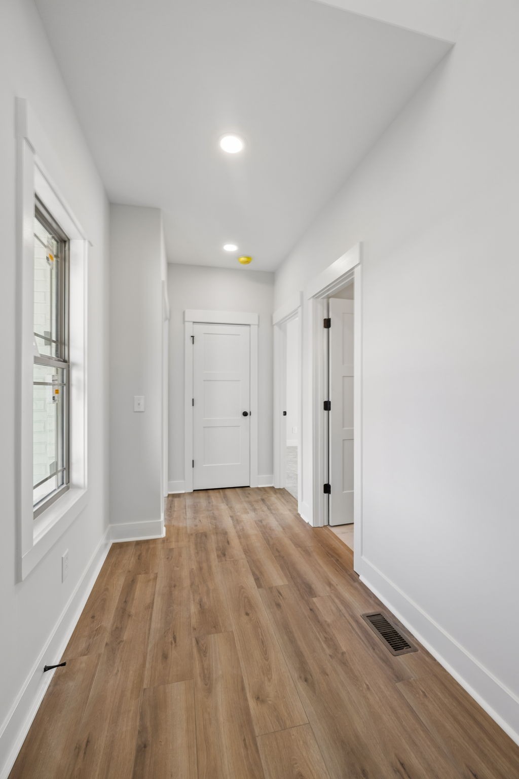 1015 Linder Ridge Road Woodlawn, TN 37191 - Photo 7 of 55 a view of a room with wooden floor and window