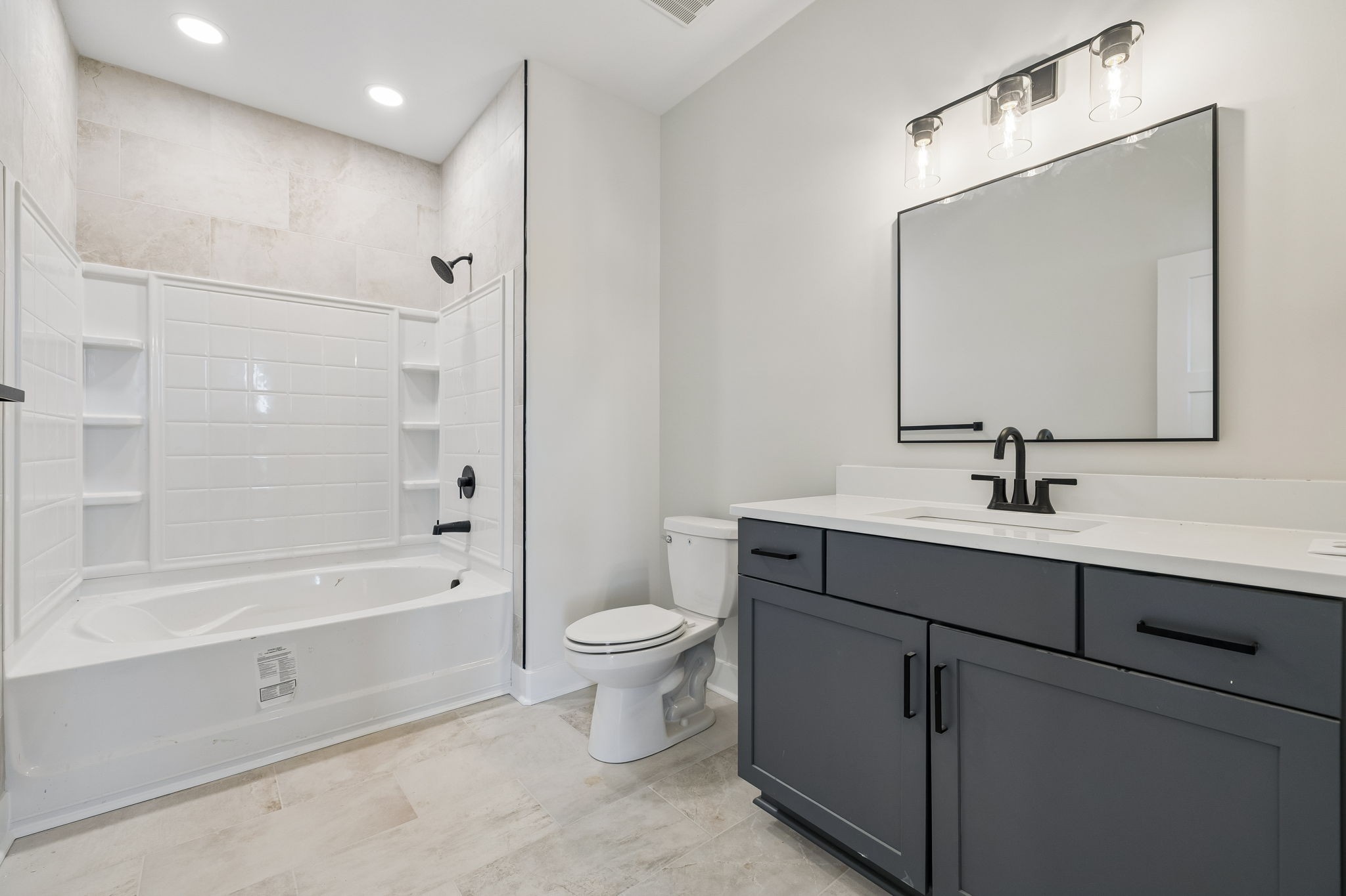 1015 Linder Ridge Road Woodlawn, TN 37191 - Photo 9 of 55 a bathroom with a sink a toilet and shower