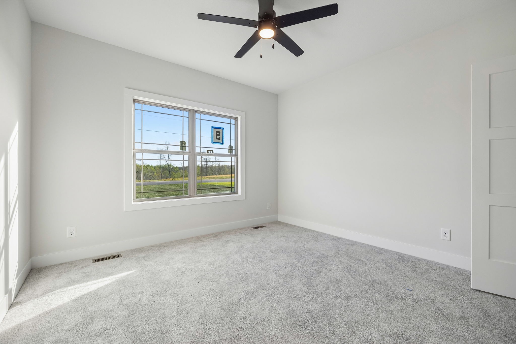 1015 Linder Ridge Road Woodlawn, TN 37191 - Photo 10 of 55 a view of an empty room with a window